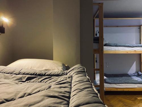 a bedroom with two bunk beds and a ladder at Madina Hostel in Cairo