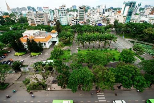 an aerial view of a park with trees and a city at Palago mc Hotel Park View in Ho Chi Minh City