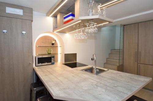 a kitchen with a counter top and a sink at Bellagio Pescallo Guesthouse in Bellagio