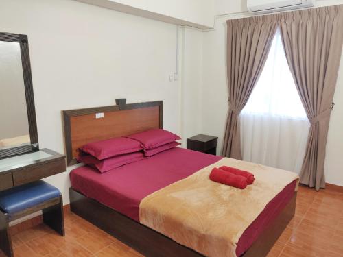 Postel nebo postele na pokoji v ubytování Wan's Apartment Bayu Beach Resort