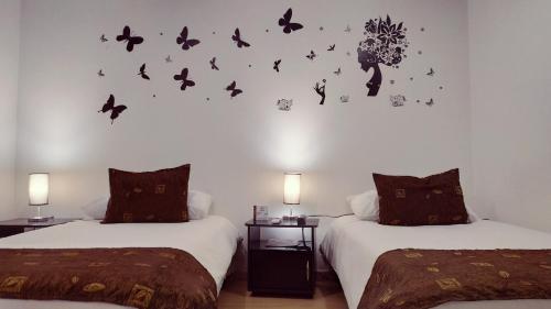 Postel nebo postele na pokoji v ubytování Hotel Confort Bogota