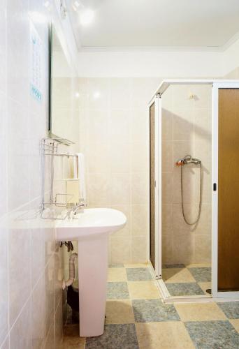 a bathroom with a sink and a shower at Cecília's House in Jardim do Mar