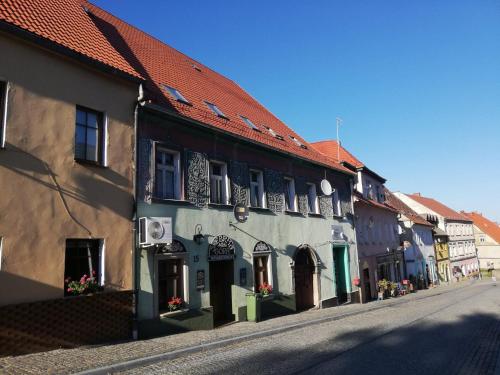 an empty street in a town with buildings at W sercu Srebrnej Góry in Srebrna Góra