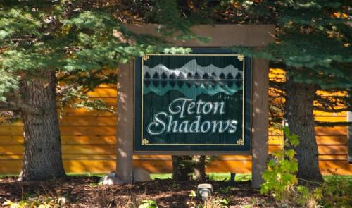 a sign in front of a log cabin at Granite A in Jackson