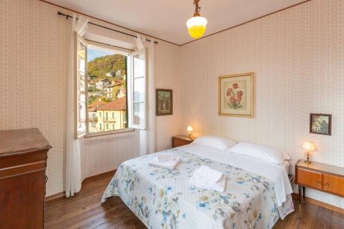 A bed or beds in a room at Vecchia Perledo 1907