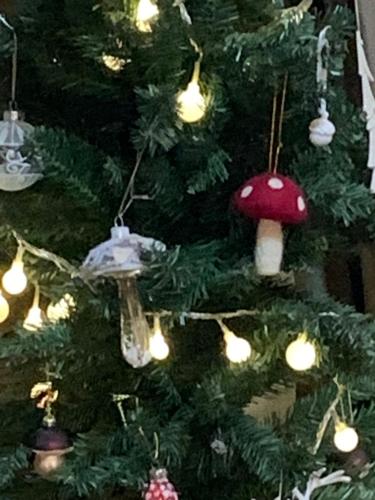 a christmas tree with christmas ornaments on it at Casa Rural Pirineu Nevà in Nevà
