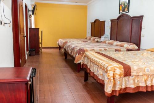 Säng eller sängar i ett rum på Hotel Campo Real Plus Tamasopo