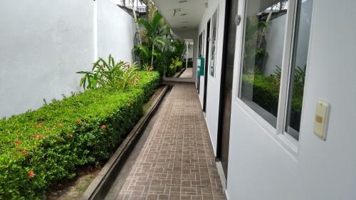 a hallway of a building with a brick walkway at Hotel Manantial Melgar Torre 2 in Melgar
