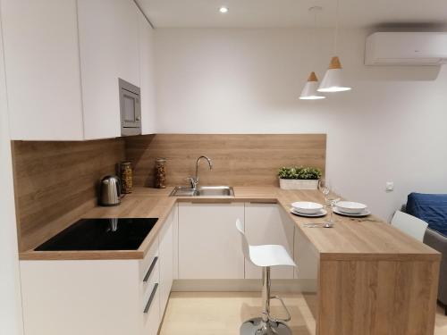 a kitchen with a sink and a counter top at Maximus apartments Marata in Saint Petersburg