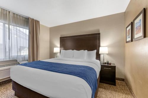 a hotel room with a large bed and a window at Comfort Inn & Suites Surprise Near Sun City West in Surprise