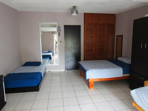 En eller flere senge i et værelse på CASA MARGARITA