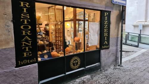 a store front of a store with a display window at Il Sole in Bergamo