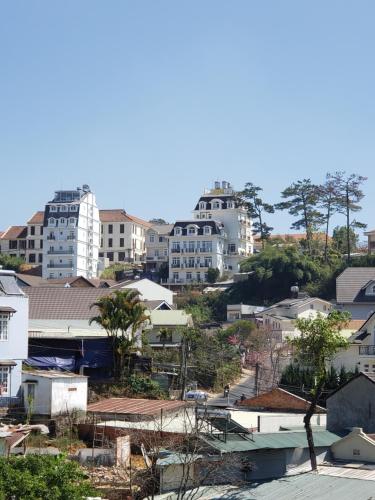 a view of a city with tall buildings at Homestay BỒ CÔNG ANH in Da Lat