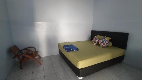 Кровать или кровати в номере Omah Kost Family Syariah