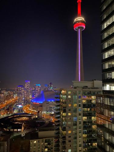 a view of the space needle at night at Stylish Condos Toronto in Toronto