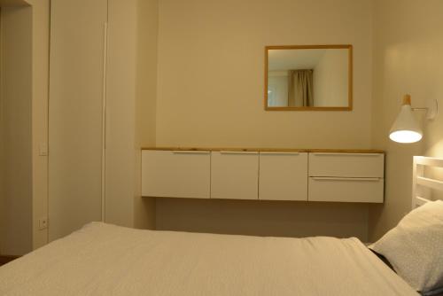 Postel nebo postele na pokoji v ubytování Juodrakantė & Neringa apartment
