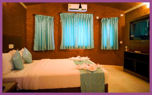 Cama o camas de una habitación en GG Resorts