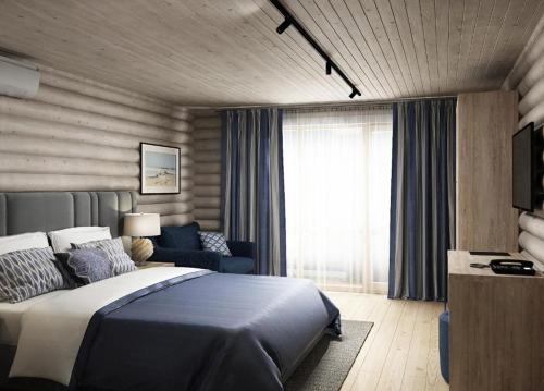アナパにあるHotel White beach All Inclusiveのベッドルーム1室(ベッド1台、ソファ、窓付)