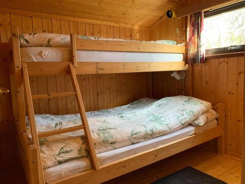 Poschodová posteľ alebo postele v izbe v ubytovaní Harekroken