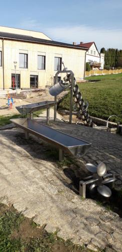 a playground with a slide and a slideintend at Apartmán Woodcock in Poniklá