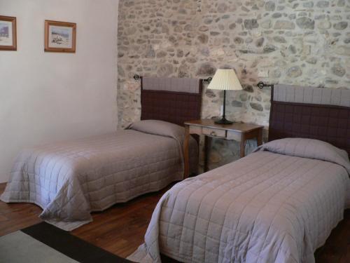 Кровать или кровати в номере La Terrasse