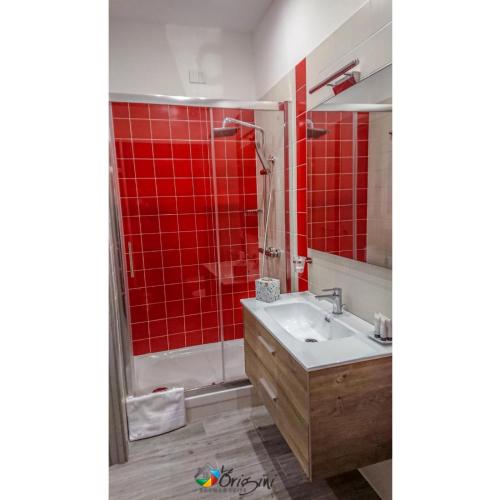 Ένα μπάνιο στο Le Origini Rooms&Suite