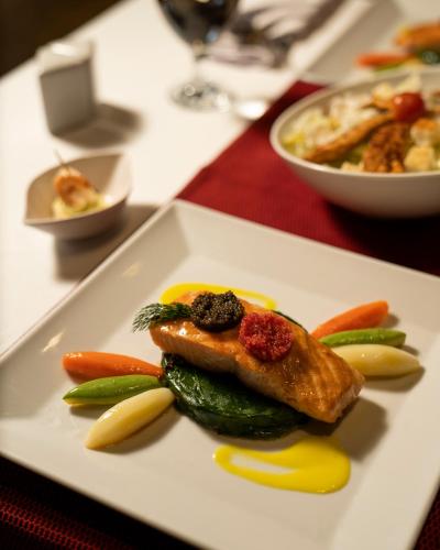 a plate of food with vegetables on a table at Grand Ocean El Sokhna in Ain Sokhna