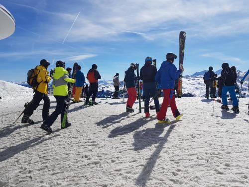 a group of people standing in the snow with skis at Ferienhaus Köck in Kartitsch