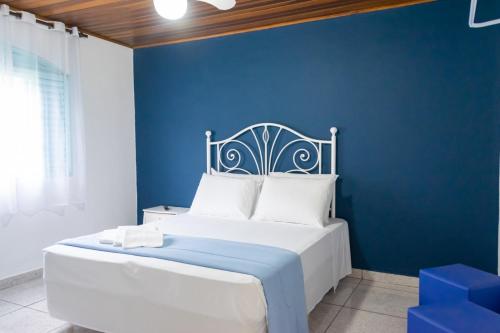 Tempat tidur dalam kamar di VILLA DO SOSSEGO pousada