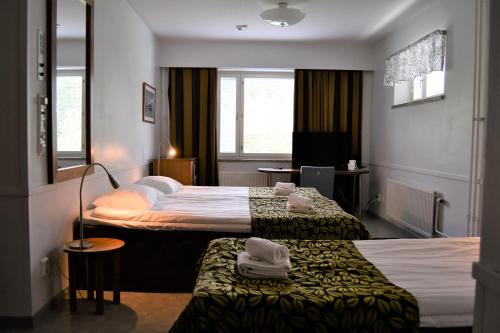 Postel nebo postele na pokoji v ubytování Budget Hotel Easystay