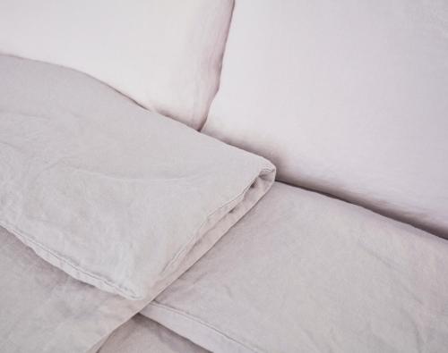 a white pillow sitting on top of a bed at Faktorei in Innsbruck