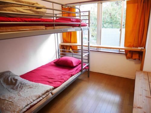 Postel nebo postele na pokoji v ubytování Guest House mii