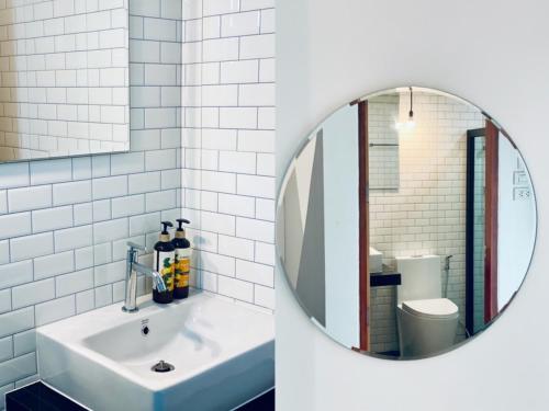 a bathroom with a sink and a mirror at Loei Station in Loei