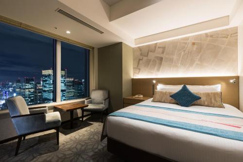 Ένα ή περισσότερα κρεβάτια σε δωμάτιο στο Hotel Metropolitan Tokyo Marunouchi