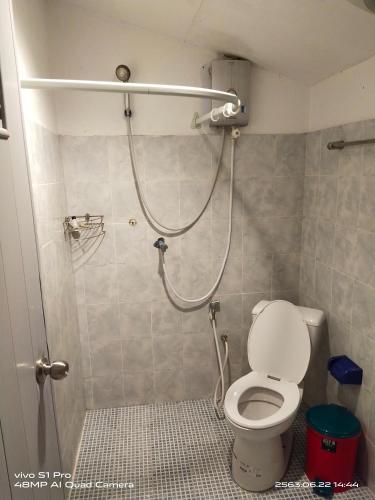 a bathroom with a shower with a toilet at Rock sand Resort in Trat