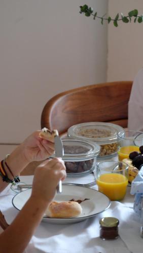 a person cutting a piece of food on a table at Flattered to be in Porto in Porto