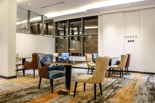 a meeting room with chairs and a table at Iris Boutique Taif Heart in Taif
