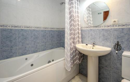 a bathroom with a sink and a bath tub and a sink at Penthouse on the beachfront in Estepona