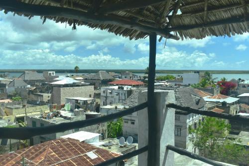 a view of a city from a balcony at JamboHouse Lamu in Lamu