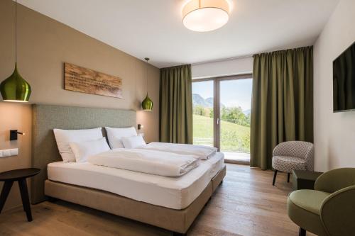 Oliven- & Genusshotel Hirzerにあるベッド