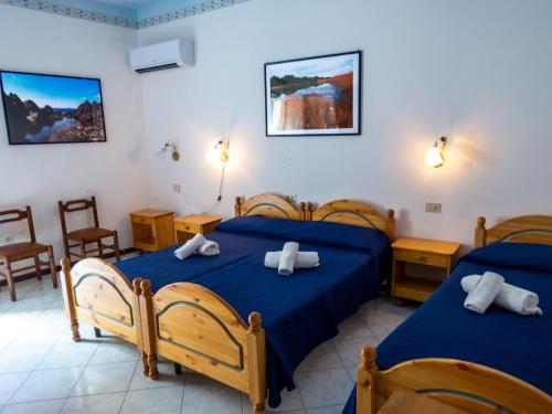 Un pat sau paturi într-o cameră la Casa Vittorio