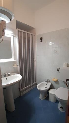a bathroom with a sink and a toilet at Casa Vittorio B&b in Lipari