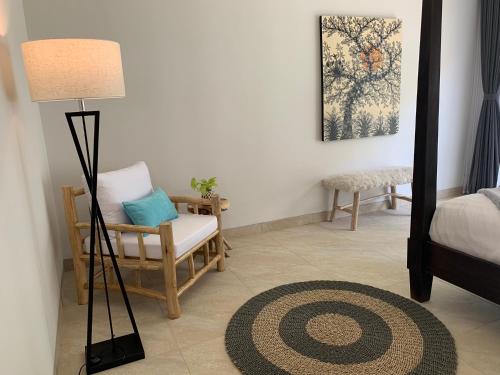 Ένα ή περισσότερα κρεβάτια σε δωμάτιο στο Premium Beachfront Villa Serenity