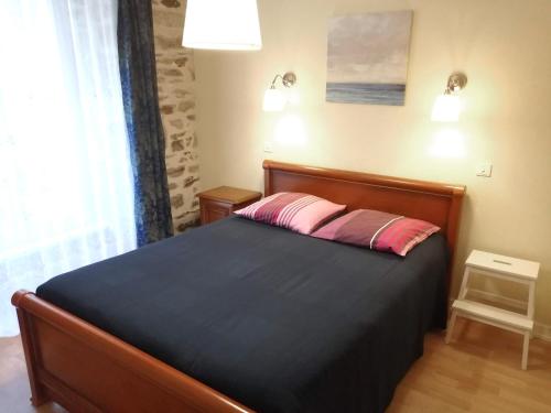 Кровать или кровати в номере Chez Gustou