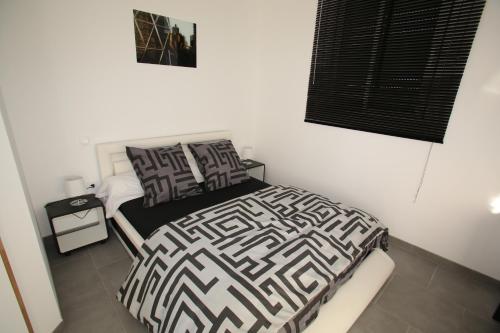 Cama o camas de una habitación en GITE MONTGOLFIÈRE 6 PERSONNES