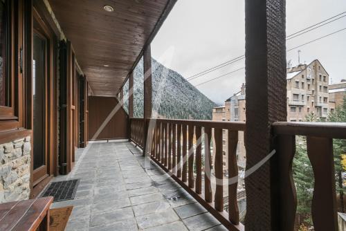 a balcony with a view of a mountain at Amitges by SeaMount Rentals in Baqueira-Beret