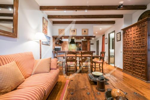 a living room with a couch and a table at Amitges by SeaMount Rentals in Baqueira-Beret