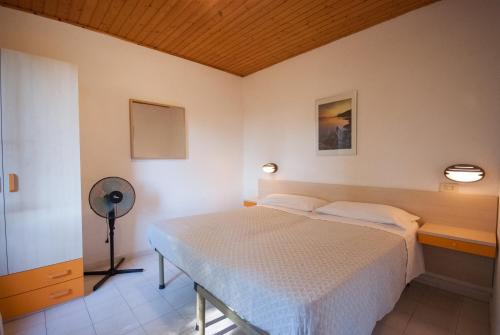 Ένα ή περισσότερα κρεβάτια σε δωμάτιο στο Residence La Valdana