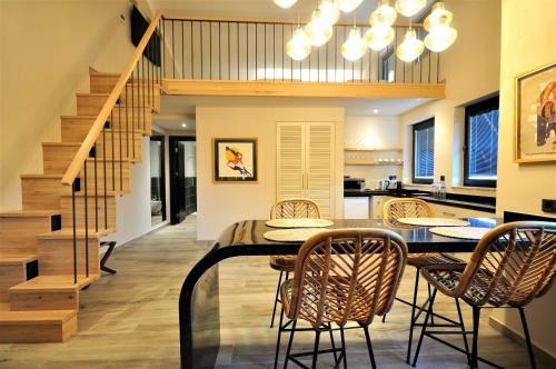 a kitchen and dining room with a table and chairs at Resa Hotel Göcek in Göcek