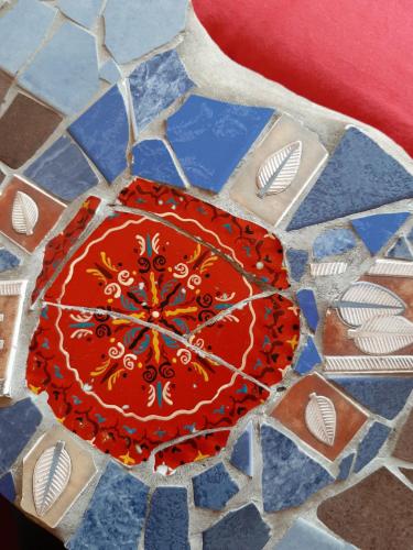a red umbrella on top of a stone floor at Hostel Lollis Homestay Dresden in Dresden